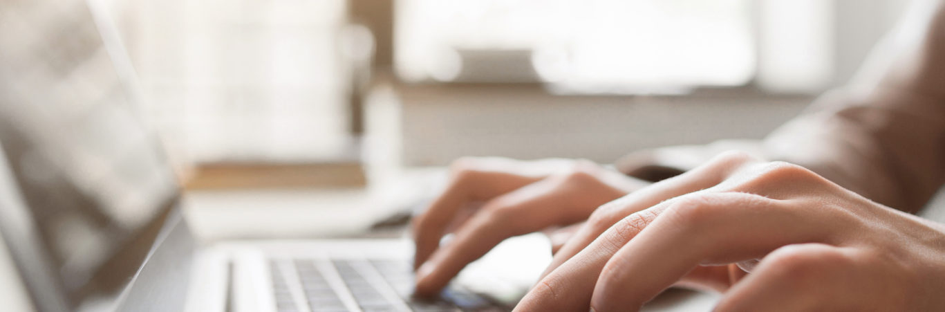Typing on laptop